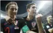  ?? FRANK AUGSTEIN — ASSOCIATED PRESS ?? Croatia’s Luka Modric, left, Sime Vrsaljko and Ivan Rakitic, right, celebrate after Croatia’s Mario Mandzukic scored his side’s second goal during their semifinal