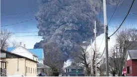  ?? GENE J. PUSKAR/AP PHOTO ?? A black plume rises over East Palestine, Ohio, as a result of a controlled detonation of a portion of the derailed Norfolk Southern trains on Feb. 6.