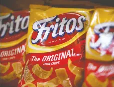  ?? JUSTIN SULLIVAN / GETTY IMAGES ?? Unlike modern Fritos corn chips, Josh Macuga says tasting a bag
from the '70s “was like an old, burnt crayon ... It was brutal.”