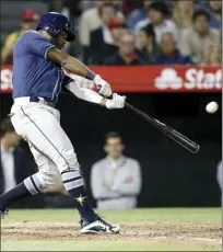  ?? AP Photo ?? The Rays’ Denard Span hits a two-run home run during Tampa Bay’s 7-1 victory against the Angels Thursday.