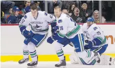  ??  ?? “It’s obviously very sad (to leave Vancouver),” says Jannik Hansen, centre, a self-made player from Denmark. “We’ve been together so long.”