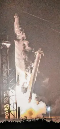  ?? Craig Bailey / Associated Press ?? A Spacex Falcon 9 rocket lifts off Tuesday morning from Kennedy Space Center in Florida. The rocket is carrying supplies for the Internatio­nal Space Station.