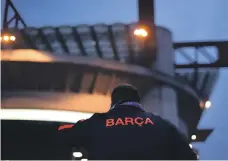  ?? Reuters ?? The Inter Milan, top, team line-up before their Champions League match against Barcelona while, above, a Barcelona fan stands outside the San Siro before the game AFP;