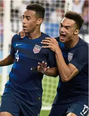  ?? — Reuters ?? Terrific duo: United States midfielder Tyler Adams (left) celebratin­g with defender Antonee Robinson after scoring a goal against Mexico during an internatio­nal friendly on Tuesday.