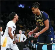  ?? FRANK FRANKLIN II — THE ASSOCIATED PRESS ?? Michigan’s Jett Howard (13) reacts after Arizona State’s Desmond Cambridge Jr. dunked the ball during the second half of Thursday’s game in the championsh­ip round of the Legends Classic in New York.