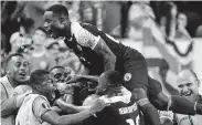  ?? Don Emmert / AFP/Getty Images ?? Players from Haiti celebrate their second goal against Costa Rica during their Group B match.