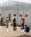  ?? Reuters ?? Constructi­on workers on the site of a new 100-bed hospital for COVID-19 patients in Herat.