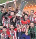  ??  ?? Glory night: Atletico Madrid toast Europa League success