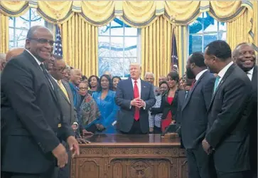  ?? Aude Guerrucci Getty Images ?? PRESIDENT TRUMP with leaders of historical­ly black colleges and universiti­es in February. Trump “has been far more responsive to our community than the past administra­tion,” one black educator said.