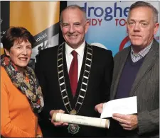  ??  ?? Vera Mooney and Eamon Clinton from Forrest Grange accept third prize in the medium sized estates category from Mayor Oliver Tully.