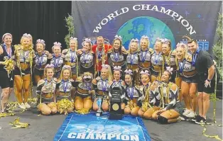  ?? REBELS CHEERLEADI­NG ATHLETICS ?? Members of Regina's Rebels Cheerleadi­ng Athletics' Smoke team celebrate after winning the Internatio­nal Open Level 5 title at the Cheerleadi­ng Worlds in Orlando, Fla., on Monday.