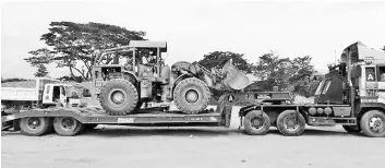  ??  ?? One of the machines seized at the sand dredging and stockpilin­g site at Kampung Rangalau in Kota Belud.