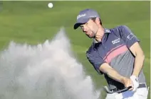  ?? LYNNE SLADKY/ASSOCIATED PRESS ?? Webb Simpson blasts from a sand trap Saturday at TPC Sawgrass. He enters today’s final round with a tournament-record 7-shot advantage.