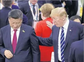  ?? Philippe Wojazer AFP/Getty Images ?? CHINESE LEADER Xi Jinping, left, urged restraint during a call with President Trump, warning against acts that could raise tensions in the Korean peninsula.