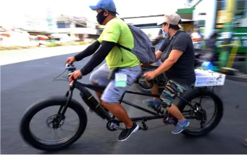  ??  ?? THEIR last day in tandem on a bike was on Monday as Tuesday brings yet another modified enhanced community quarantine in Metro Manila and its fringes due to the big spike in new coronaviru­s cases.