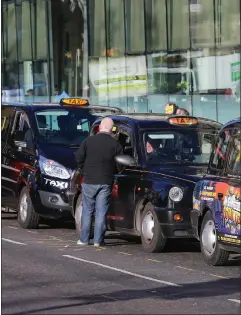  ??  ?? Glasgow cabbies ranked along West George Street