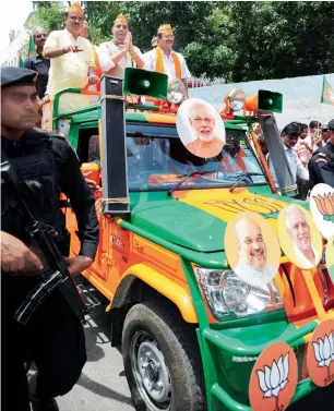  ?? PTI ?? union home minister rajnath Singh and Ananth Kumar campaign for Chickpet constituen­cy candidate uday garudachar, right, ahead of the assembly polls in Bengaluru on Sunday. —