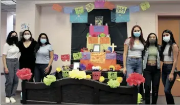  ?? ?? The SDSU Imperial Valley students show the artifacts used on the altar they created to honor Sor Juana’s memory.