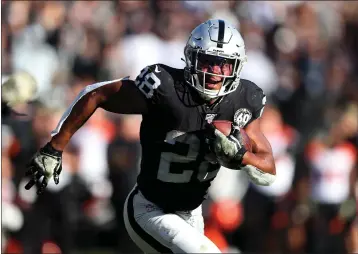  ?? ARIC CRABB — BAY AREA NEWS GROUP ?? Raiders running back Josh Jacobs rushes up field during the first half of their game against the Bengals on Nov. 17 in Oakland.