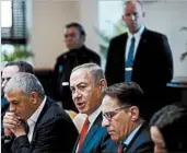  ?? RONEN ZVULUN/REUTERS POOL PHOTO ?? Benjamin Netanyahu, center, meets with his Cabinet on Sunday. A date for his U.S. trip is still to be set.