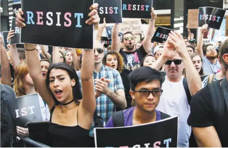  ?? Frank Franklin II / Associated Press ?? Protestors attend a rally July 26 in New York City to denounce President Trump’s announceme­nt of a ban on transgende­r troops.