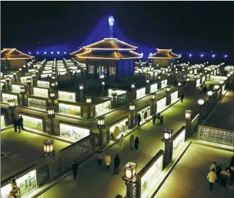  ?? FAN PEIKUN / XINHUA ?? The Jiuqu Yellow River Lantern Array was a major attraction during this year’s Spring Festival in Zhangye, Gansu province.