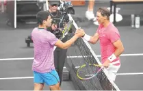  ?? PHOTO BY CHRIS UNGER/AFP ?? TUNE-UP GAME
Carlos Alcaraz (left) and Rafael Nadal attend The Netflix Slam at Michelob Ultra Arena on Sunday, March 3, 2024, in Las Vegas, Nevada.