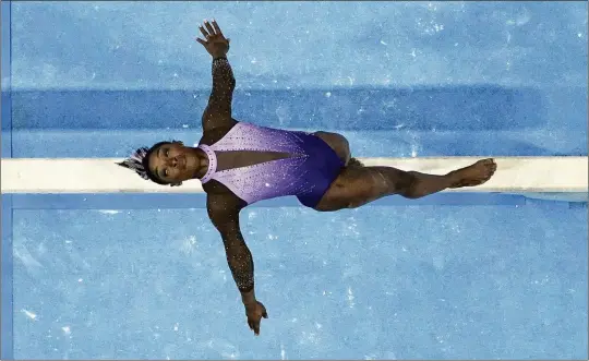  ?? JED JACOBSOHN/ASSOCIATED PRESS ?? Simone Biles competes on the balance beam at the U.S. Gymnastics Championsh­ips last month in San Jose, Calif. Biles won gold medals in two individual events (beam, floor exercise) and became the oldest woman to win the all-around title. She has won a record eight national all-around titles.