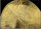  ?? ARNOLD MIKKELSEN, THE NATIONAL MUSEUM OF DENMARK VIA AP ?? The inscriptio­n “He is Odin’s man” is seen in a round half circle over the head of a figure on a golden bracteate unearthed in Vindelev, Denmark, in late 2020.
