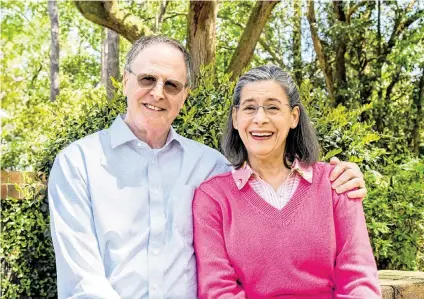  ?? DREW MARTIN dmartin@islandpack­et.com ?? Russell “Rusty” Floyd and his wife, Laura Floyd, pose for a photo April 9 on the grounds of First Presbyteri­an Church on Hilton Head Island. On May 19, Rusty will retire as the minister of music at the church, a position he has held since 1999.