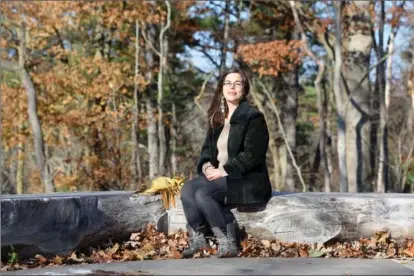  ??  ?? Kaitlin Debicki sits amid the trees near McMaster. “I have a thing with trees,” says the woman who gave a valedictor­y address at Mac’s fall convocatio­n.