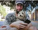  ?? Mark Mulligan / Houston Chronicle ?? Patrick Gillespie is working on getting an ID so he can find a permanent place to live with his dog Franklin. They were reunited through the kindness of a stranger.