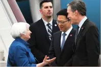  ?? — AFP ?? China’s vice-minister of finance Liao Min (second right) and US Ambassador to China Nicholas Burns (right) receive Yellen.