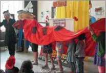  ?? PHOTO PROVIDED ?? Amy Trompetter and students from the AJ Williams-Myers African Roots Library perform in a puppet show at last year’s My Kinsgton Kids Fest. The free festival, which features a “Willy Wonka and the Chocolate Factory” theme and activities ranging from a...