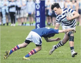  ?? PHOTO:GERARD O’BRIEN ?? No you don’t . . . Otago Boys’ High School centre Jake Te Hiwi tries to outstep Southland Boys’ High School opposite number Jordan Smith in the Southern Region Top Four final at Littlebour­ne in Dunedin on Saturday.