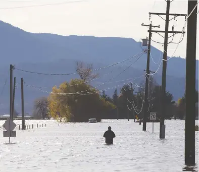  ?? TAEHOON KIM / BLOOMBERG ?? Days of torrential rain have pelted British Columbia, triggering floods and landslides that have blocked the tracks of the nation's two major railways and washed away parts of its main east-west road artery, the Trans-Canada Highway.