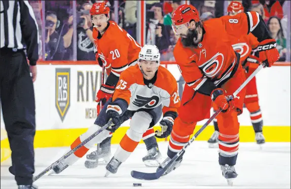  ?? Karl B Deblaker The Associated Press ?? Carolina’s Brent Burns, right, remains an imposing figure on the ice at the age of 39, still chasing his first Stanley Cup.