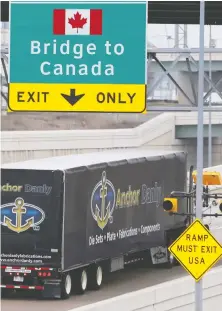  ?? REBECCA COOK/REUTERS FILES ?? A commercial truck heads for the Ambassador Bridge at the internatio­nal border crossing that connects Detroit with Windsor, Ont. Canada’s April trade deficit is projected to be worse.