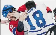  ?? GRAHAM HUGHES/ THE CANADIAN PRESS ?? Montreal’s Brandon Prust fights with Toronto’s Mike Brown during the first period Saturday night.