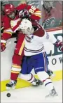  ?? GETTY IMAGES ?? Habs rearguard Josh Gorges drives Guillaume Desbiens into boards during Canadiens’ loss in Calgary on Tuesday.