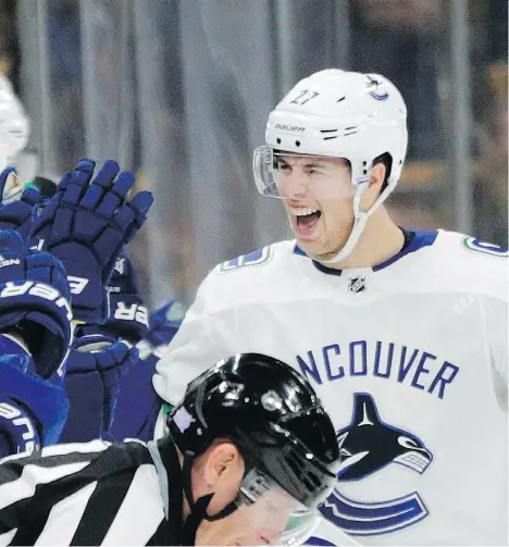  ?? ELISE AMENDOLA/THE ASSOCIATED PRESS ?? “The game is so fast, you have to make split-second decisions and that comes with a little bit of confidence,” says Canucks defenceman Ben Hutton. “Last year, I wouldn’t have had the confidence to keep the puck on my stick and cut back and make a play.”