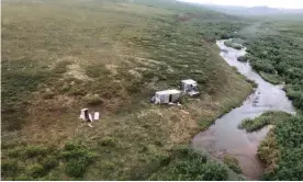  ?? Photograph: US coast guard/AFP/ Getty Images ?? A remote mining camp near Nome, Alaska, where a Coast Guard Air Station Kodiak aircrew rescued the survivor of a bear attack, on 16 July.