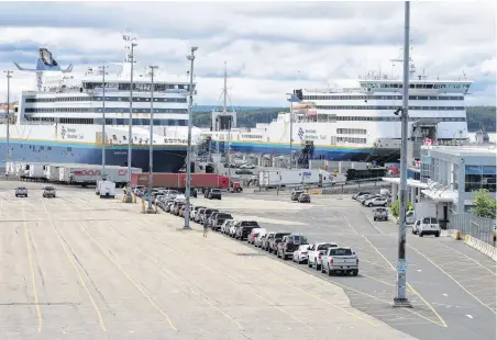  ?? JEREMY FRASER/CAPE BRETON POST ?? Vehicles are shown lined up at the Marine Atlantic terminal in North Sydney on July3. More than 30 vehicles were preparing to board Marine Atlantic’s MV Blue Puttees for the 11:45 a.m. crossing, the first since the opening of the Atlantic bubble Friday.