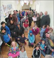  ?? PHOTO SUBMITTED BY JANET EASLEA ?? Students and parents at The Montessori School in Dresher spent time on Martin Luther King Day, Jan. 20, 2020. sorting and assembling a variety of items for charitable organizati­ons including Abington Hospital, Cradle of Hope, Cradles to Crayons and Laurel’s Loft — which supports Laurel House. The school’s family service projects on MLK Day often involve collecting items in advance and assembling items for distributi­on with the help the students. In this photo, Montessori School families gather together for their annual “Family Service Project” on Martin Luther King Jr. Day — Jan. 20, 2020.