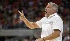  ?? VASHA HUNT — THE ASSOCIATED PRESS ?? Auburn head coach Bruce Pearl signals in during the first half of Saturday’s game against Yale in Auburn, Ala.