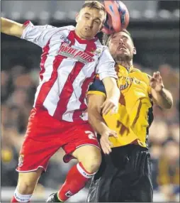  ?? FM3523164 Buy this picture from kentonline.co.uk ?? Stones defender Jamie Coyle challenges in the air