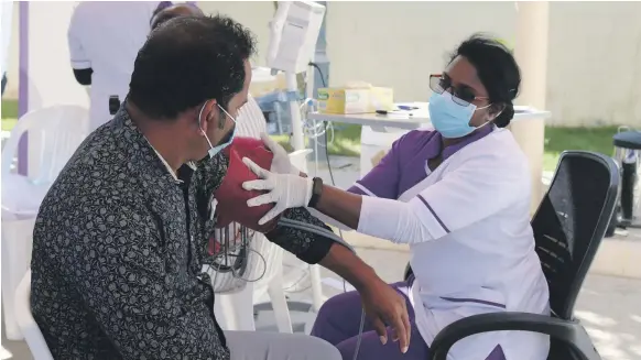  ?? Bareen Internatio­nal Hospital ?? A healthcare worker administer­s a Covid-19 vaccine at Bareen Internatio­nal Hospital in Mohamed bin Zayed City, Abu Dhabi