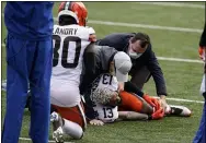  ?? MICHAEL CONROY — THE ASSOCIATED PRESS ?? Odell Beckham Jr. is examined after tearing the ACL in his left knee against the Bengals on Oct. 25 in Cincinnati.