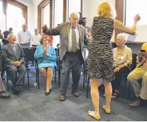  ?? Leah Millis / The Chronicle ?? David Perlman, 98, dances with Chronicle reporter Nanette Asimov while his colleagues play a song they wrote for him as Mayor Ed Lee and Sen. Dianne Feinstein applaud.