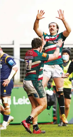  ??  ?? Jump for joy: Tigers’ Kobus Van Wyk celebrates a Leicester try